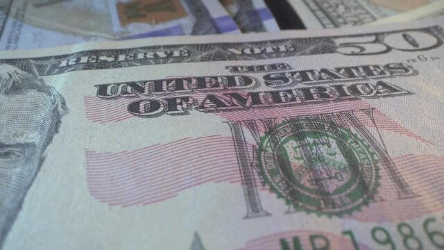 American cash money. 50 USD with water mark and sign United States of America. Finance abd business concept macro shot. Department of the treasure sign on green stamp.