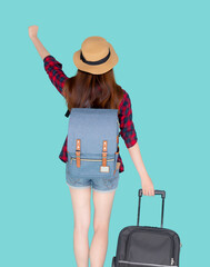 Back view young asian woman pulling suitcase isolated on blue background, asia girl having expression is cheerful holding luggage walking in vacation with excited, journey and travel concept.