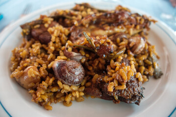 Close Up Still Life View of Traditional Spanish Paella Dish Made with Yellow Saffron Rice. Valencia.