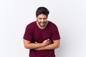 Fototapeta premium Young handsome man with beard over isolated white background smiling a lot
