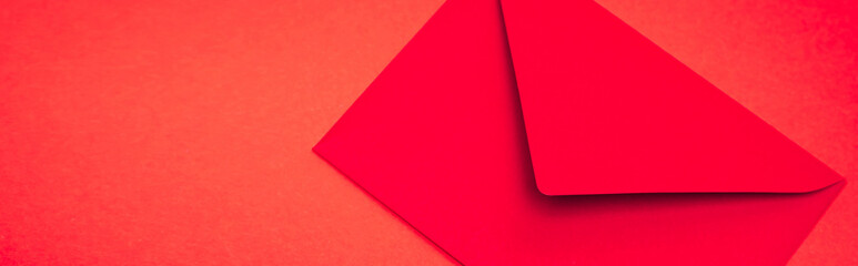 Top view of envelope on red background, banner