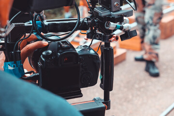Behind the scene. cameraman shooting film scene with camera