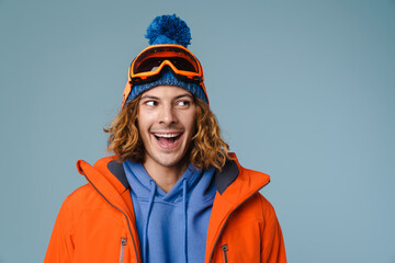 Caucasian joyful sportsman smiling and looking aside