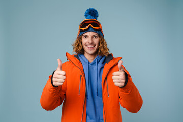 Caucasian joyful sportsman showing thumbs up on camera
