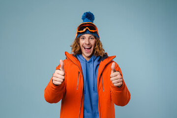 Young excited sportsman showing thumbs up on camera