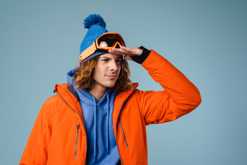 Caucasian concentrated sportsman posing and looking aside