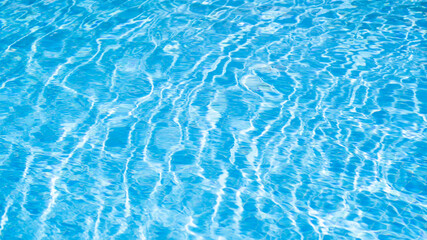 Waving water texture backdrop. Swimming pool water sun reflection background. Ripple water. Water background abstract