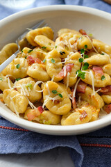 Gnocchi with bacon and asparagus beans. Italian food.