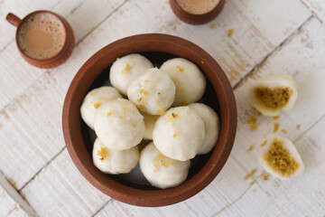 Kozhukatta Pidi and Indian milk tea Kerala tea time snack steamed food rice flour, sweet food stuffed with grated coconut jaggery, christian food Palm sunday. sweet modak rice dumpling Ganesh Festival