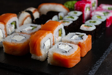 Set of different rolls, philadelphia close-up on a dark background