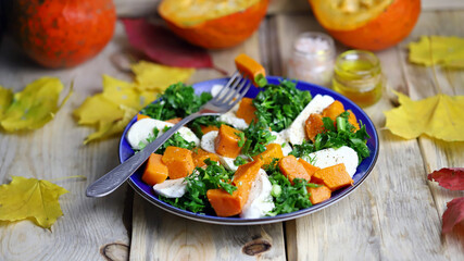 Autumn pumpkin salad with mozzarella. Healthy food. Autumn mood.