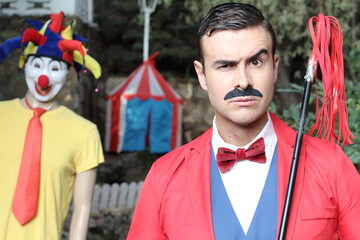 Ringmaster and clown in the circus