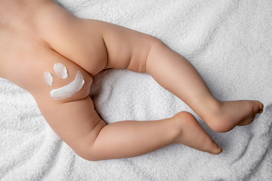 close up Picture of a smile on children's buttocks used diaper cream, baby bum and feet, concept cleaning wipe, pure, clean