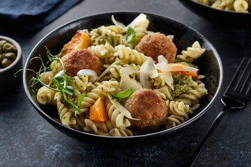 Pasta with meatballs and homemade parsley pesto sauce. Copy space.