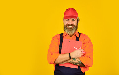 Bearded storekeeper. Check list. Control concept. Courier with document. Waybill or delivery note. Delivery service. Supplier of goods. Delivery man in cap holding clipboard looking information