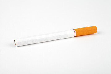 Ð¡igarette with an orange filter on a white background, close-up, place for text.