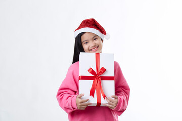 Asian Child hugging Christmas gift box in hand