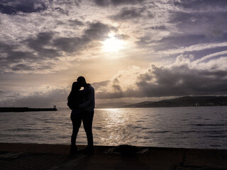 Couple in love kissing near the sea with incredible views.