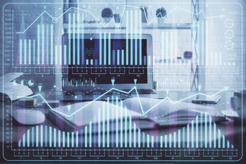 Financial graph colorful drawing and table with computer on background. Double exposure. Concept of international markets.