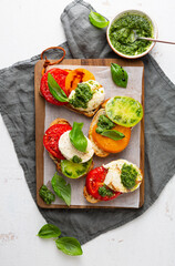 Tomato and cheese toast with pesto sauce