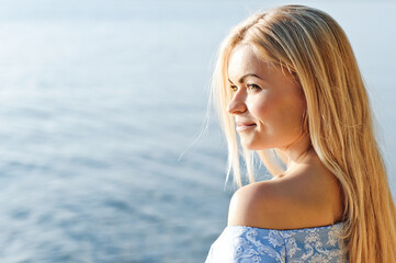 Fototapeta na wymiar Outdoor fashion portrait of romantic blonde. Summer moment