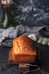 Freshly baked poppy seed pie. Cake with fondant. Baking with poppy seeds on a dark background