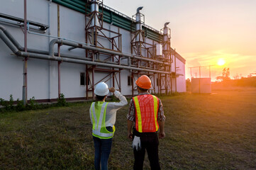 Construction manager and engineer working on building site