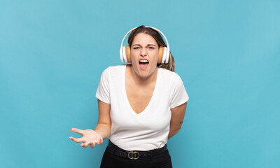 young blonde woman looking angry, annoyed and frustrated screaming wtf or what’s wrong with you