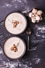 Mushroom soup. Soup with fresh mushrooms. Two plates of cream soup with vegetables