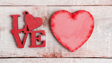 Heart and text I love you on an old wooden background. Valentine's day