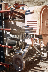 Concrete mixer on a empty construction site outdoors.