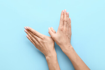 Woman showing dove with her hands on color background. International Day of Peace