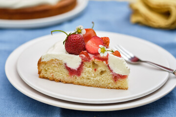 Pie with cream and strawberries on a summer background. . Homemade summer dessert.