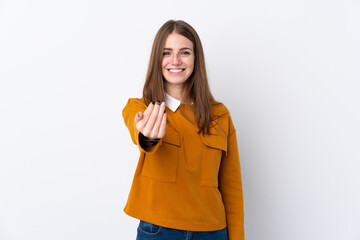 Young woman over isolated white background inviting to come with hand. Happy that you came