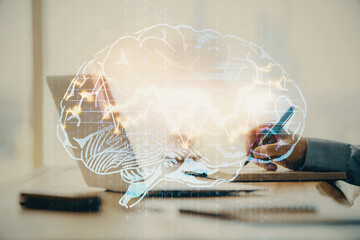 Man typing on keyboard background with brain hologram. Concept of big Data.