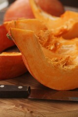 Fresh ripe pumpkin on a wooden table  