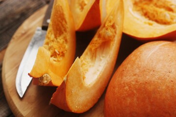 Fresh ripe pumpkin on a wooden table  