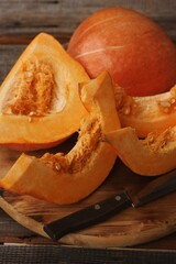 Fresh ripe pumpkin on a wooden table  