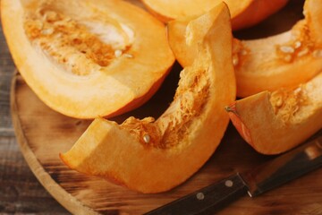 Fresh ripe pumpkin on a wooden table  