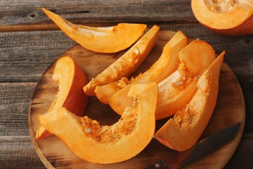 Fresh ripe pumpkin on a wooden table  