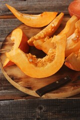 Fresh ripe pumpkin on a wooden table  