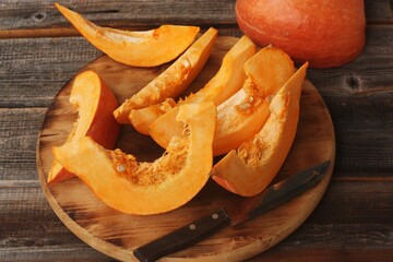 Fresh ripe pumpkin on a wooden table  