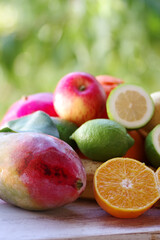 sliced orange, mango fruit and citric fruits