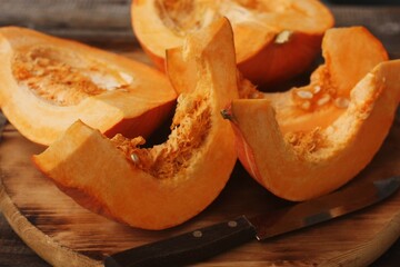 Fresh ripe pumpkin on a wooden table  