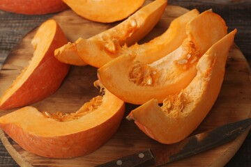 Fresh ripe pumpkin on a wooden table  