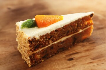 Delicious carrot cake on a wooden table 