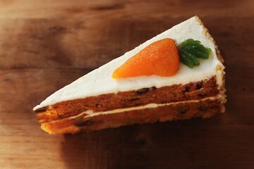 Delicious carrot cake on a wooden table 