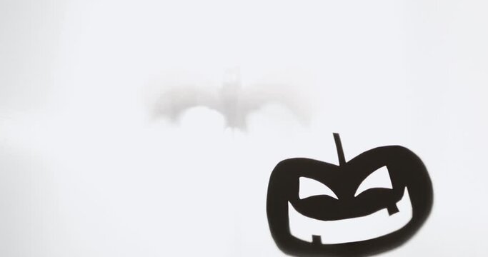 Kids playing with cardboard shadows puppet held by sticks Halloween Decoration,  4k, cinematic, medium close-up, steady shot