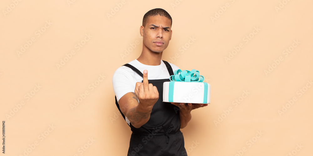 Sticker young black man feeling angry, annoyed, rebellious and aggressive, flipping the middle finger, fighting back