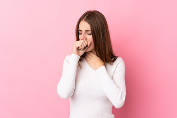 Young woman over isolated pink background is suffering with cough and feeling bad